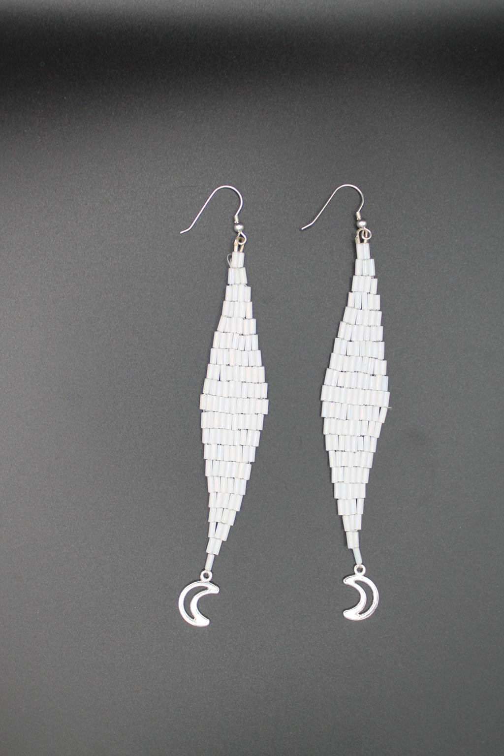 White moon lure earrings