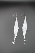 White moon lure earrings