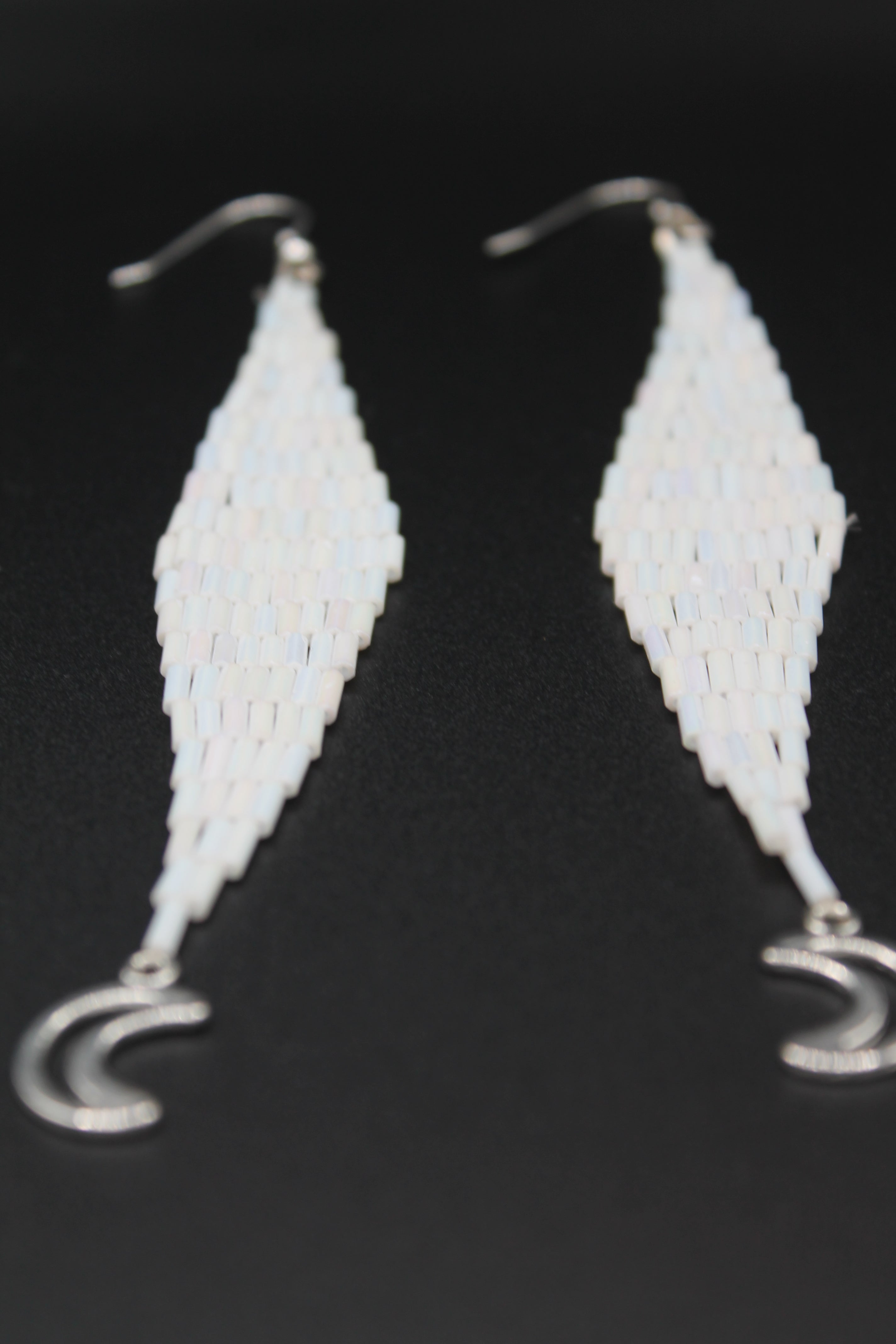 White moon lure earrings